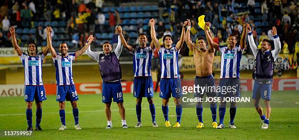 Porto's players celebrate after the UEFA Europa League semi-final second leg football match between Villarreal and Porto at the Madrigal Stadium in...