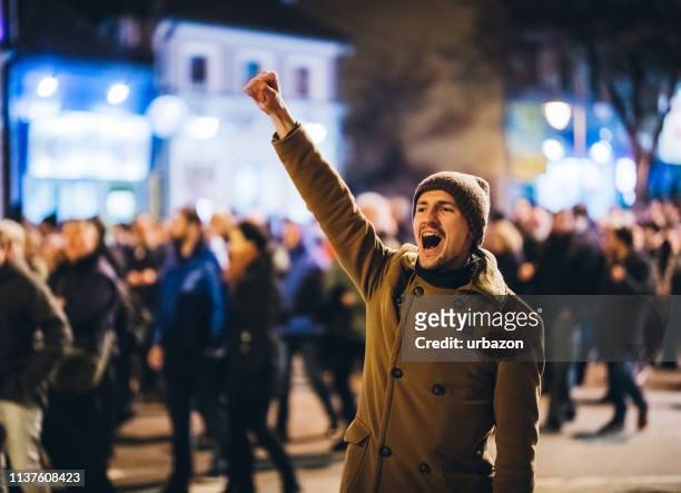 freedom fighter - crowd shouting stock pictures, royalty-free photos & images