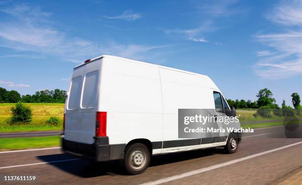 delivery van driving on highway - lieferwagen stock-fotos und bilder