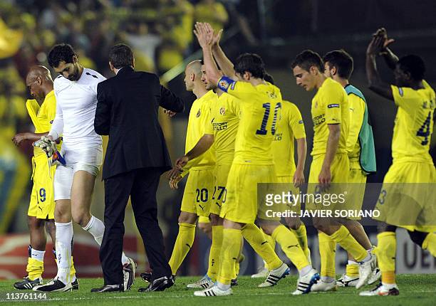 Villarreal players react after the UEFA Europa League semi-final second leg football match between Villarreal and Porto at the Madrigal Stadium in...