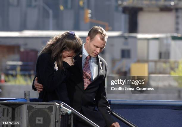 Family members of the victims of the September 11 terror attacks console one another during the ceremony to commemorate the fourth anniversary of the...