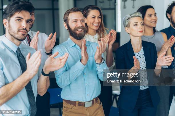 applause at business conference - applauding staff stock pictures, royalty-free photos & images