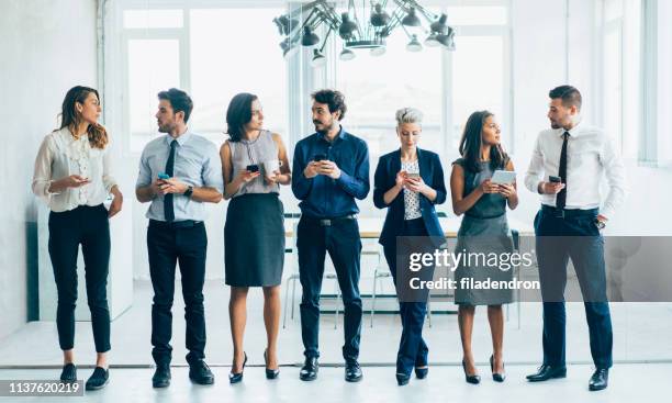 business people using digital devices - bussines group suit tie stock pictures, royalty-free photos & images
