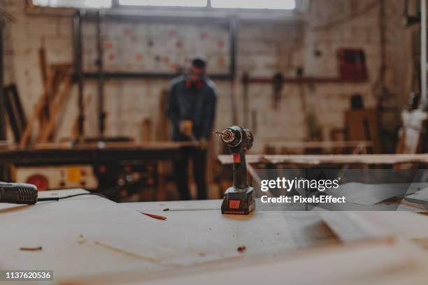 carpenter working in the workshop - woodshop stock pictures, royalty-free photos & images