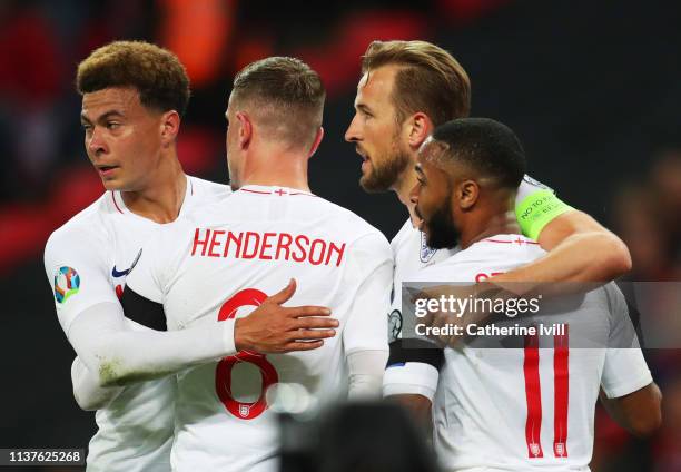 Harry Kane of England celebrates as scores his team's second goal from a penalty with Raheem Sterling, Jordan Henderson and Dele Alli during the 2020...