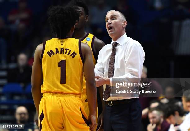 Head coach Bobby Hurley of the Arizona State Sun Devils speaks to Remy Martin during the first half of the first round game of the 2019 NCAA Men's...