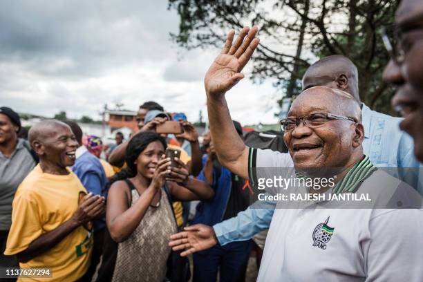 Former South African President and former president of the ruling party African National Congress Jacob Zuma waves to supporters during a short visit...
