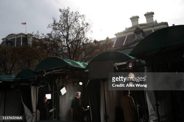Correspondents from major TV networks participate in stand-up shots as they report from the White House March 22, 2019 in Washington, DC. Special...