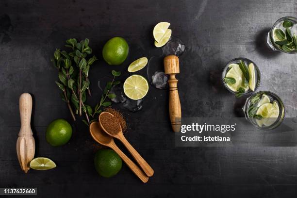 green guacamole sauce ingregients and fresh dip in rural mug - caipirinha stock pictures, royalty-free photos & images