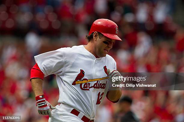 Lance Berkman of the St. Louis Cardinals rounds the bases after hitting the game-winning three-run home run against the Florida Marlins at Busch...