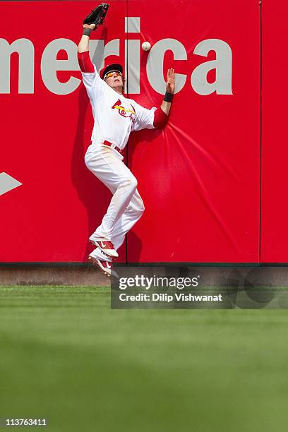 Colby Rasmus of the St. Louis Cardinals misplays a fly ball against the Florida Marlins at Busch Stadium on May 5, 2011 in St. Louis, Missouri.