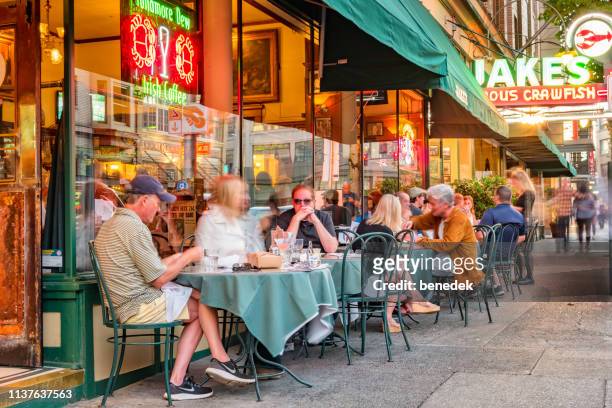 restaurant patio in downtown portland oregon usa - portland neon sign stock pictures, royalty-free photos & images