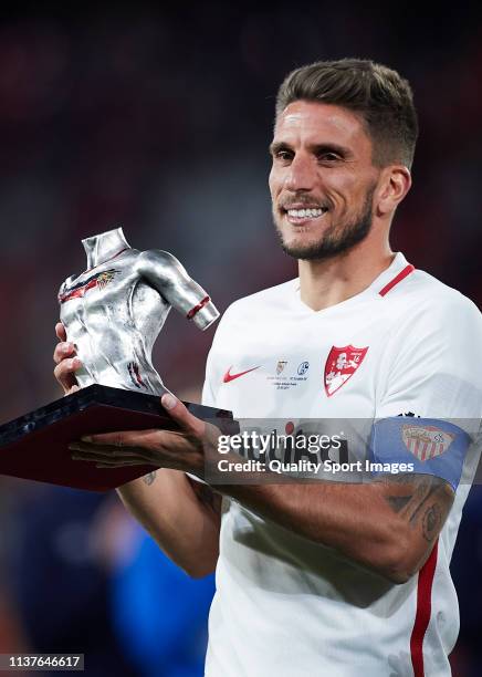 Daniel Carrico of Sevilla FC holds the Antonio Puerta trophy after the match between Sevilla FC and Shalke 04 as part of the friendly match Trofeo...