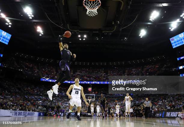 Matisse Thybulle of the Washington Huskies goes up to the basket against Abel Porter of the Utah State Aggies during the first half of the game in...