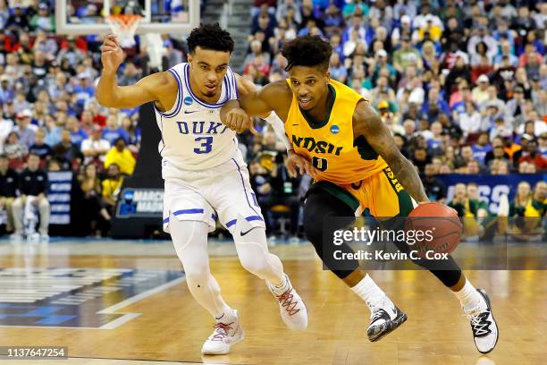 Vinnie Shahid of the North Dakota State Bison is defended by Tre Jones of the Duke Blue Devils in the first half during the first round of the 2019...