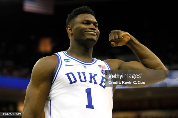 Zion Williamson of the Duke Blue Devils reacts after scoring a basket and drawing a foul against the North Dakota State Bison in the second half...