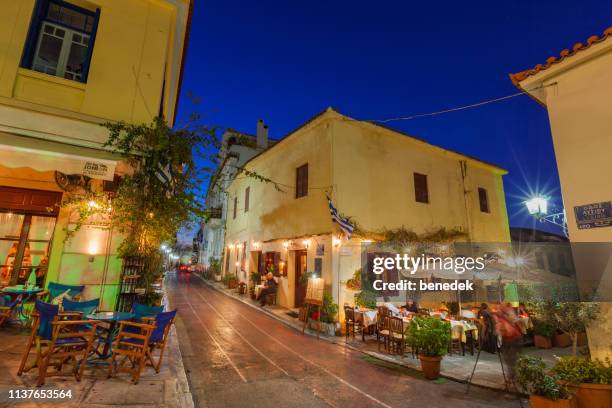 restaurants patios in plaka district downtown athens greece - plaka stock pictures, royalty-free photos & images