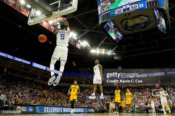 Barrett of the Duke Blue Devils dunks the ball as teammate Zion Williamson celebrates against the North Dakota State Bison in the second half during...