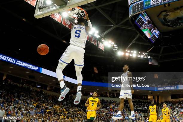 Barrett of the Duke Blue Devils dunks the ball as teammate Zion Williamson celebrates against the North Dakota State Bison in the second half during...