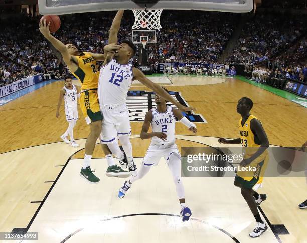 Cameron Hunter of the North Dakota State Bison attempts a shot against Javin DeLaurier of the Duke Blue Devils in the second half during the first...