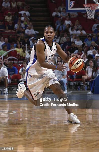Elaine Powell of the Orlando Miracle drives upcourt in the game against the Indiana Fever on July 3, 2002 at TD Waterhouse Centre in Orlando,...