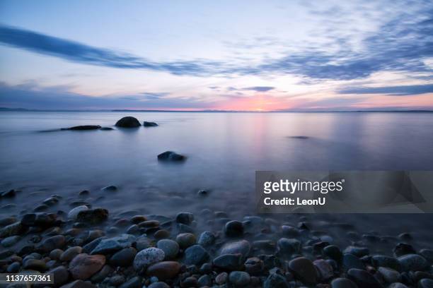 crescent beach at sunset, surrey, bc, canada - tranquility stock pictures, royalty-free photos & images