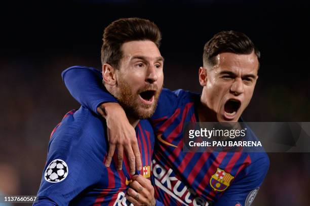 Barcelona's Argentinian forward Lionel Messi celebrates with Barcelona's Brazilian midfielder Philippe Coutinho after scoring a goal during the UEFA...