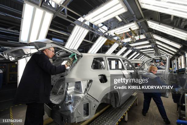 Workers assemble Skoda Kodiaq cars on the production line of carmaker GAZ plant in Nizhny Novgorod on April 16, 2019.