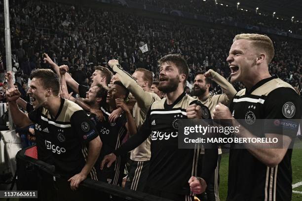 Ajax's Dutch defender Joel Veltman, Ajax's Danish midfielder Lasse Schone, Ajax's Dutch midfielder Donny van de Beek and teammates celebrate with...