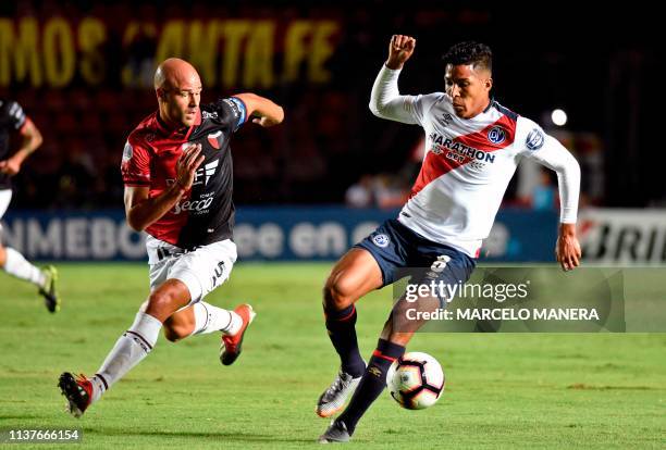 Carlos Uribe Zambrano of Peruvian Deportivo Municipal vies for the ball with Matias Fritzler of Argentinian Colon during a Copa Sudamericana 2019...