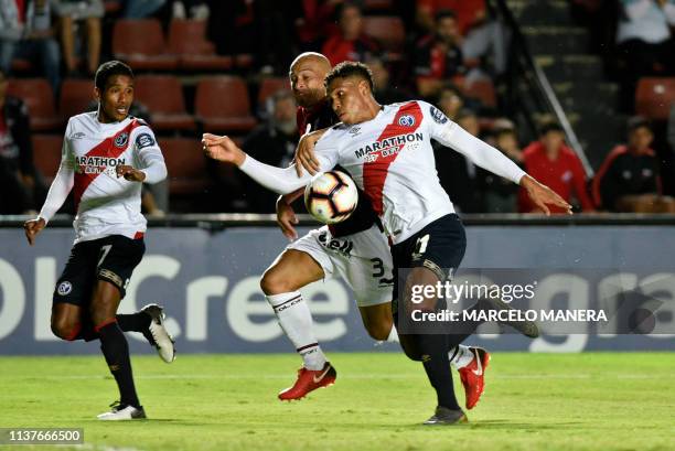 Italo Regalado of Peruvian Deportivo Municipal vies for the ball with Clemente Rodriguez of Argentinian Colon during a Copa Sudamericana 2019...