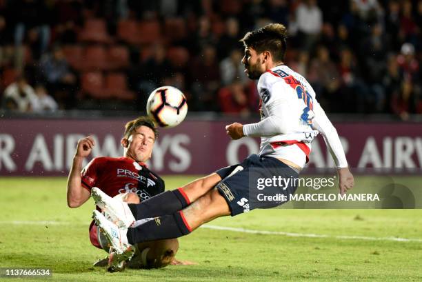 Pier Larrauri of Peruvian Deportivo Municipal vies for the ball with Guillermo Ortiz of Argentinian Colon during a Copa Sudamericana 2019 football...