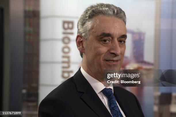 Frank Appel, chief executive officer of Deutsche Post AG, poses for a photograph after a Bloomberg Television interview in Singapore, on Wednesday,...