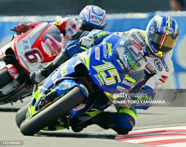 MotoGP rider Sete Gibernau of Spain leads Japanese Makoto Tamada in the motorcycle Grand Prix of Japan in Suzuka, central Japan, 06 April 2003....