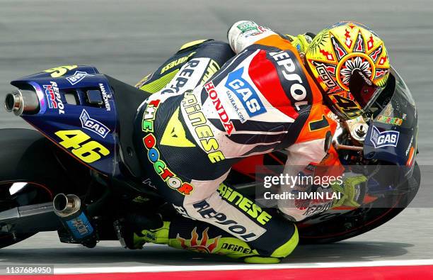 MotoGP World Champion Italian rider Valentino Rossi of Repsol Honda takes a sharp turn during the free practice session of the 2002 Malaysian...