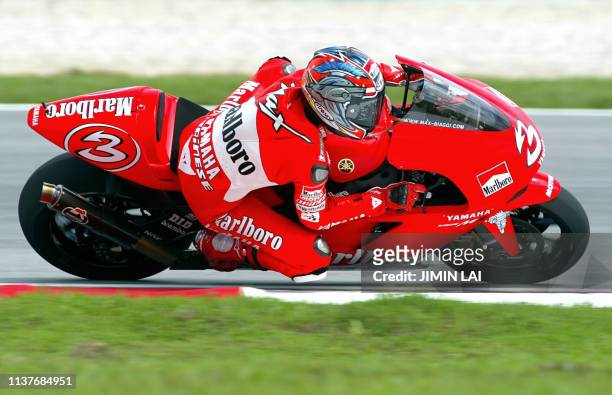 MotoGP rider Italian Max Biaggi of Marlboro Yamaha leans into a corner during the free practice session of the 2002 Malaysian Motorcycle Grand Prix...
