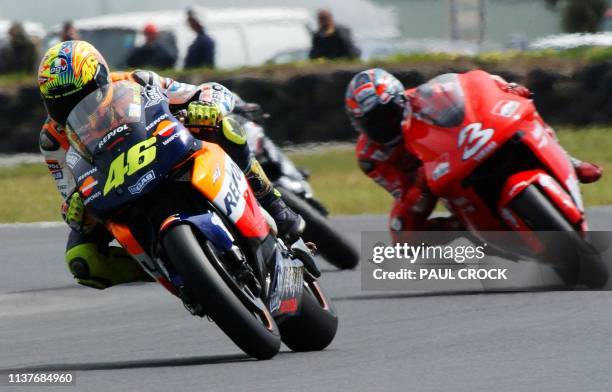 Valentino Rossi of Italy leads arch rival and compatriot Max Biaggi during practice session at the Australian Motorcycle Grand Prix in Phillip...