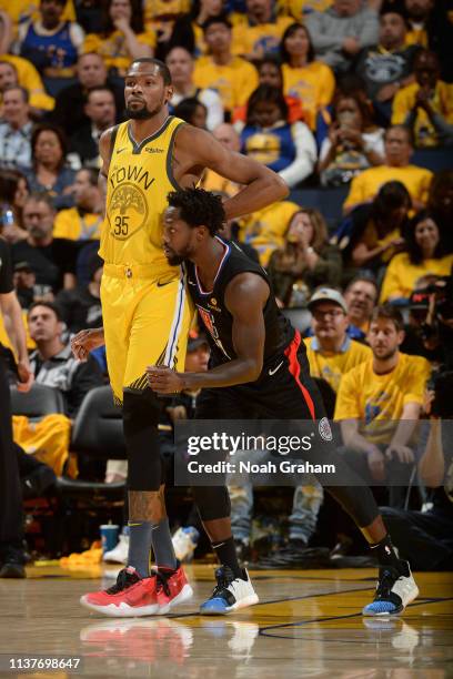 Patrick Beverley of the LA Clippers plays defense against Kevin Durant of the Golden State Warriors during Game Two of Round One of the 2019 NBA...