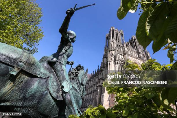 Statue of Jeanne D'arc is seen in the grounds of the medieval Roman Catholic Notre-Dame de Reims Cathedral also known as Our Lady of Reims on April...