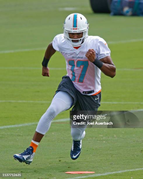 Brice Butler of the Miami Dolphins runs a drill during the team's voluntary minicamp on April 17, 2019 at the Miami Dolphins training facility in...