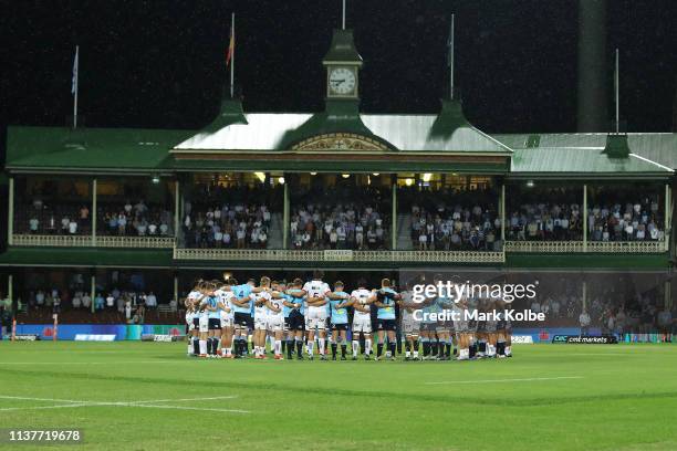 The Crusaders and Waratahs team form a huddle together as pay their respects to the victims of the March 15th Christchurch shootings before the round...