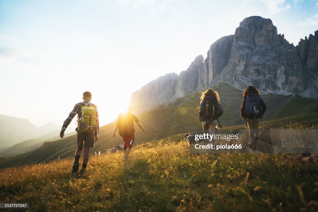 Adventures on the Dolomites: teenagers hiking with dog