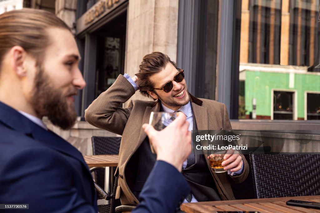 Business break - Two young businessmen taking a break in Central London