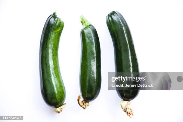 three zucchini - courgette stock-fotos und bilder