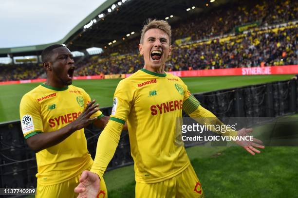 Nantes' French midfielder Valentin Rongier and Nantes' Ghanean forward Majeed Waris celebrate the team third goal during the French L1 football match...