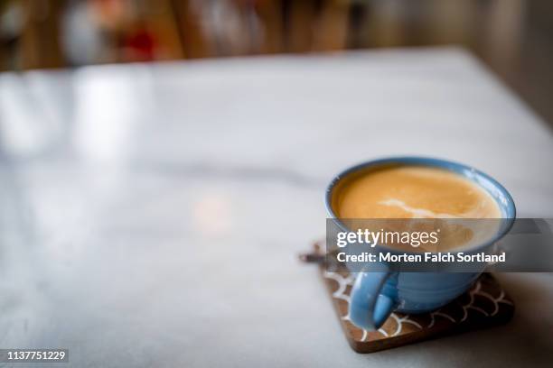 a hot cup of coffee on a fine day in mueang chiang mai, thailand - beer mat stock pictures, royalty-free photos & images