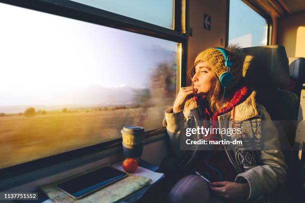 traveler on a journey with train - train window stock pictures, royalty-free photos & images