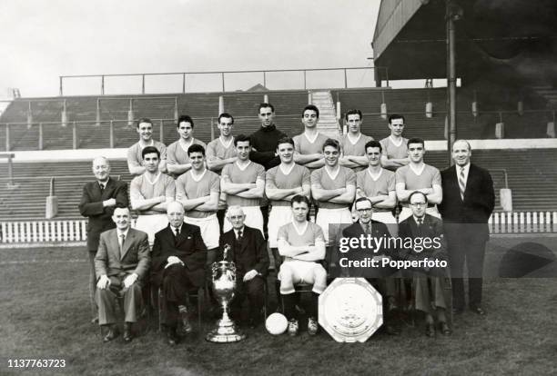 Manchester United with the League Championship trophy and the FA Charity Shield at Old Trafford in Manchester, circa September 1956. Left to right,...