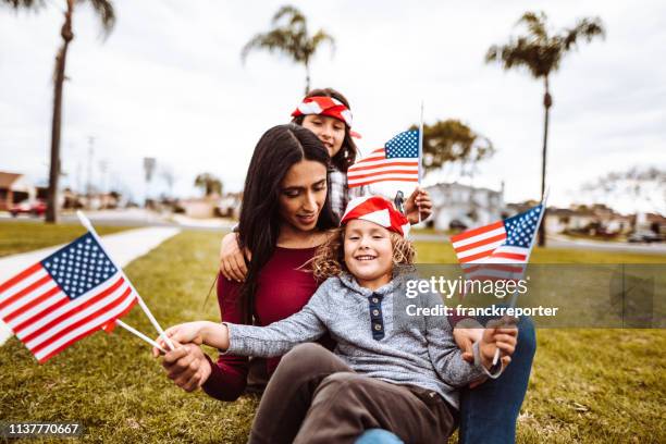 little boys with family celebrate the fourth of july - the love parade stock pictures, royalty-free photos & images