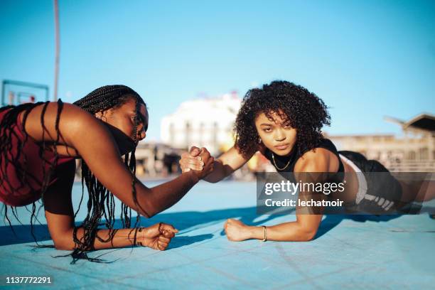 cross training on the basketball courts of venice beach, california - venice beach stock pictures, royalty-free photos & images